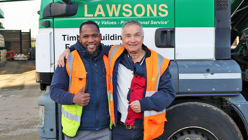 Tazio Heath and Simon Lawson in front of the lorry due for Jamaica