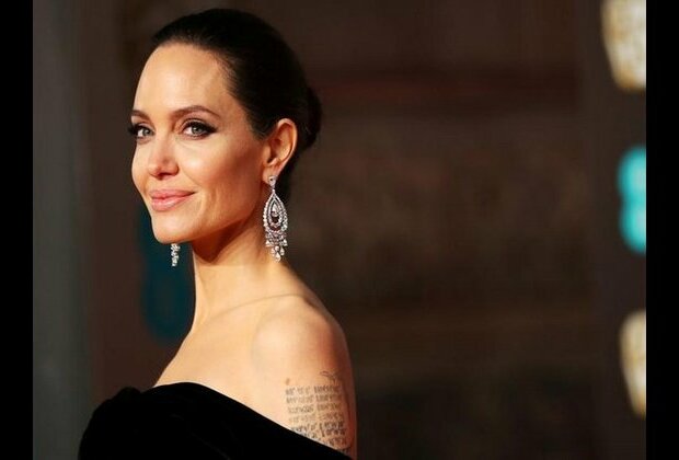 Angelina Jolie tries 'not to cry' as she drops son to college