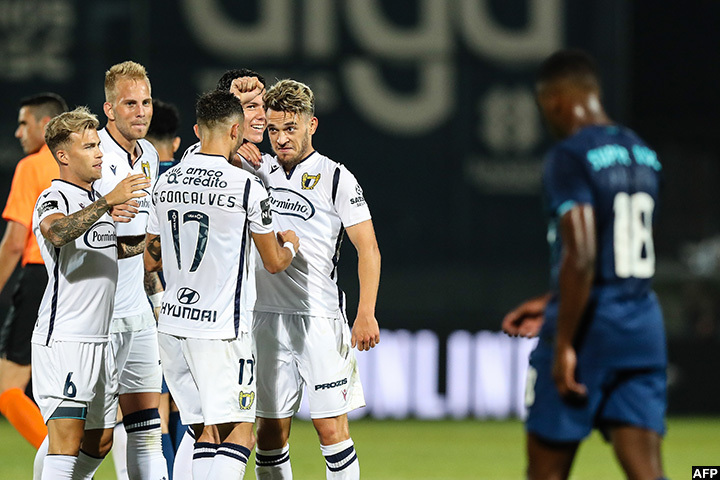 FC Famalicao's Portuguese midfielder Pedro Goncalves (C) celebrates after scoring during the Portuguese league football match FC Famalicao against FC Porto. (Photo by Jose COELHO / POOL / AFP)