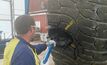 A worker repairing a tyre in Macmahon's tyre repair facility at Tropicana.