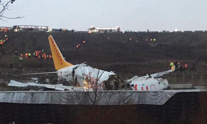 Plane skids off runway, breaks into two Plane skids off runway, breaks into two
