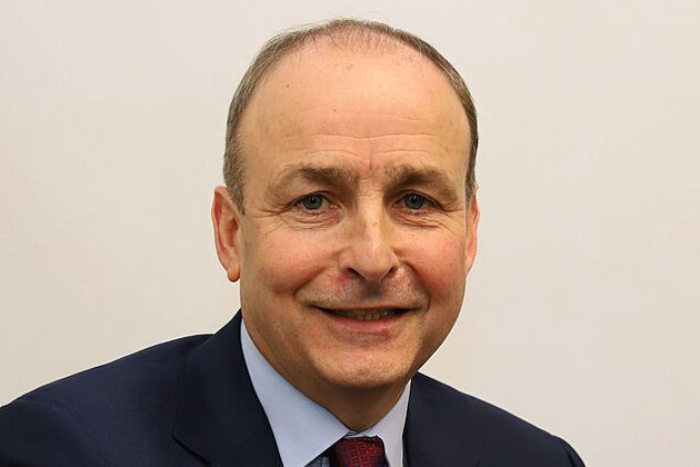 Irish leader defends payments to applicants who leave Ireland