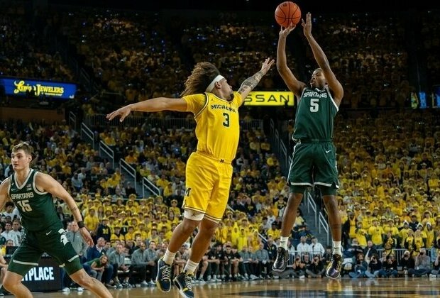 No. 14 Michigan State tops No. 12 Michigan, leads Big Ten