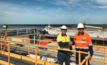 NCZ port manager, Greg O’Shea, and Carpentaria Shire Councillor, Peter Wells, standing with the MV Wunma containing the 500,000th zinc concentrate tonne produced