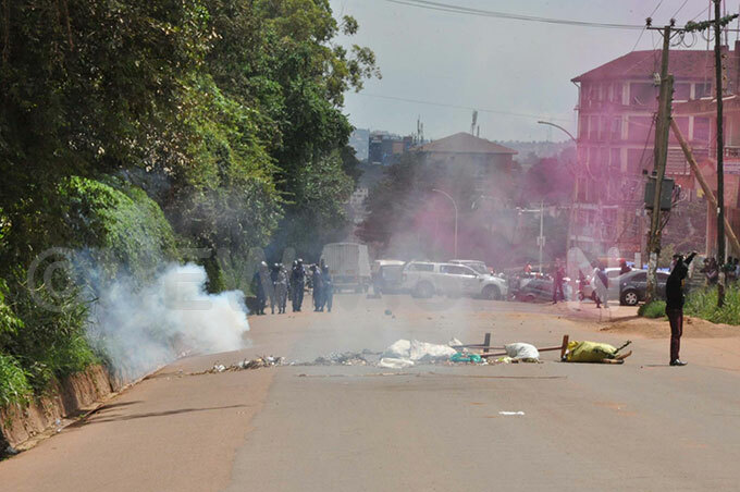 olice fires tear gas at akerere niversity striking students who had blocked the road and were throwing stones at olice along sir pollo aggwa road hoto by immy uta