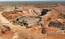 Image looking northwest showing historical pit, waste dumps and stockpiles.
