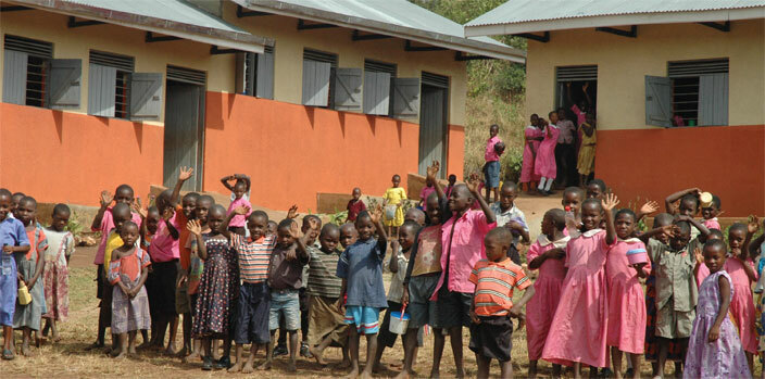 upils standing at some of the classrooms that were constructed by orld ision