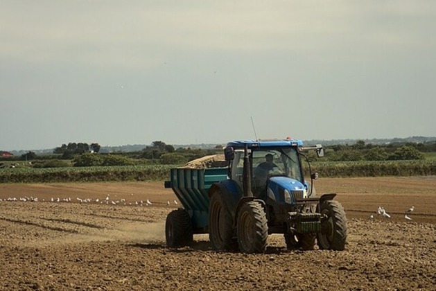French farmers bring tractors to Paris to press for ease in rules