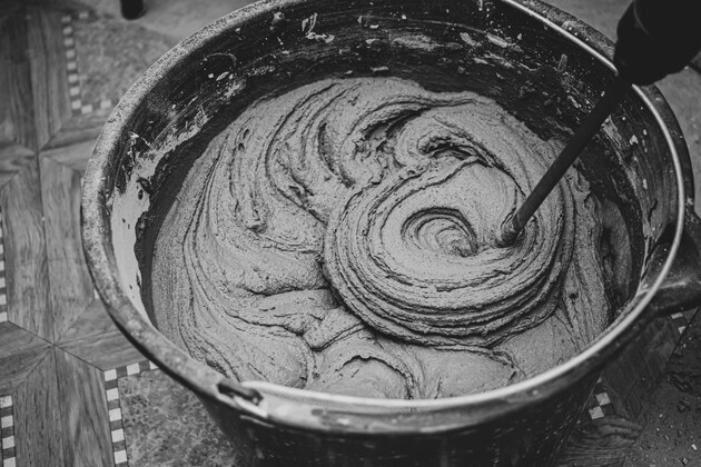 Paper Mill Sludge Ash Enhances Geocrete Performance