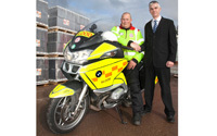 Roofing firm gives charity extra va-va-voom