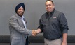 Guneet Bedi, GM, Americas at relayr, and Shawn Collins, executive director, US regional service centers at Flanders, shake hands as the new partnership becomes official