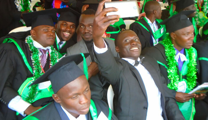  raduates take a selfie during their graduation function 