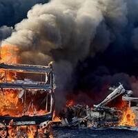 More than 30 double-decker buses go up in flames at depot as police launch arson investigation