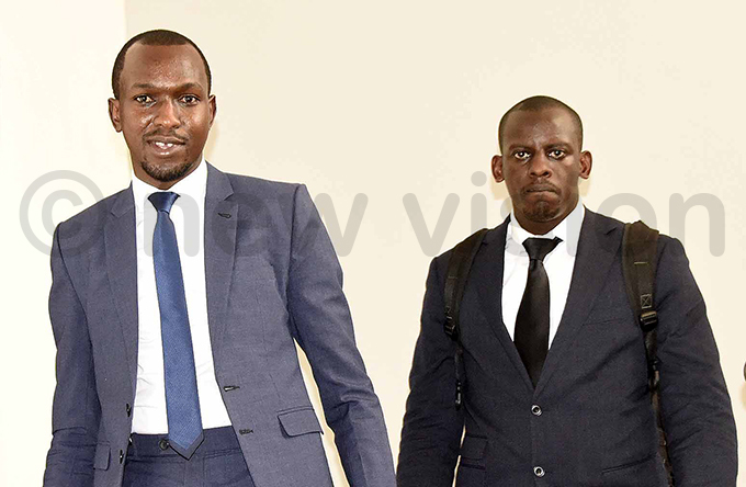 ionel uhangi right the son of businessman harles uhangi leaves igh ourt with his lawyer nthony agira hoto by ennedy ryema