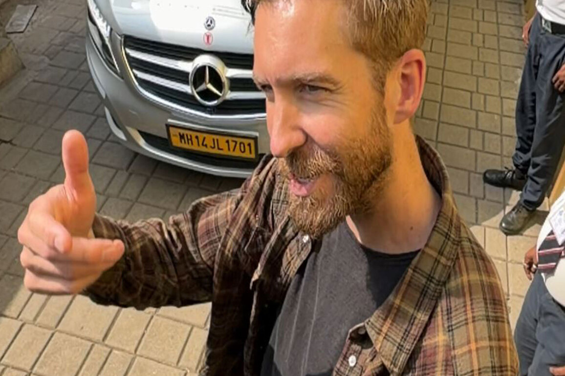 Calvin Harris poses for paps at Mumbai airport