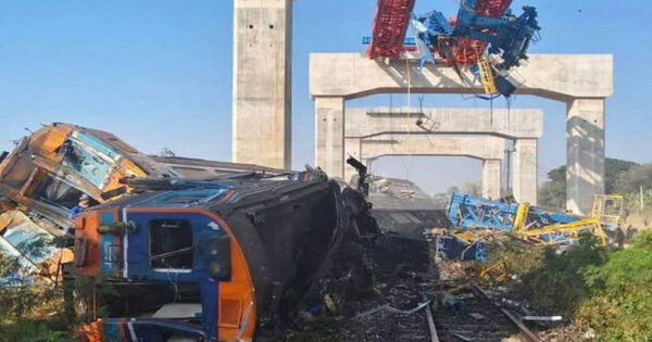 Construction crane falls onto moving train killing 32 in Thailand