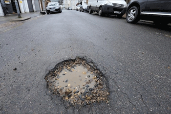 Roads funding cuts 'equal to eight million pothole repairs'