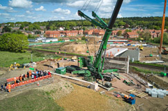 Residents crane to see bridge beam job