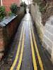 Double yellows painted in alleway too narrow to drive down