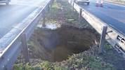 Highways Agency contractors stabilise 15-foot deep sinkhole on M2