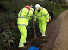 Volunteers carrying out pothole repairs in Devon