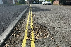 Shock as council paints over potholes